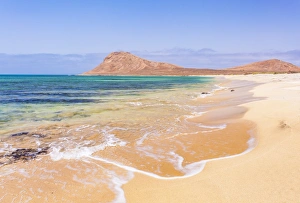 Empty sandy beach and bay near Monte Leao mountain (Sleeping Lion mountain), Sal Island Empty sandy beach and bay near Monte Leao mountain (Sleeping Lion mountain), Sal Island