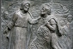 Sculpture of the calling of St. Peter on the Notre Dame door Sculpture of the calling of St. Peter on the Notre Dame door