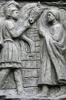 Sculpture depicting a Miracle on the Notre Dame door, Saint-Pierre de Montmartre church Sculpture depicting a Miracle on the Notre Dame door, Saint-Pierre de Montmartre church