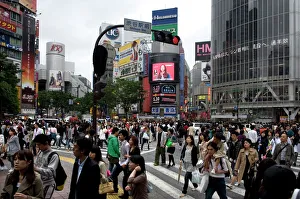 Shibuya crossing in front of the Shibuya train station is one of Tokyos busiest city centers Shibuya crossing in front of the Shibuya train station is one of Tokyos busiest city centers