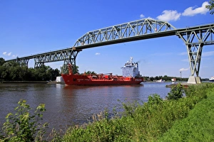 Ship on Kiel Canal going under the Railway Bridge of Hochdonn, Dithmarschen, Schleswig-Holstein Ship on Kiel Canal going under the Railway Bridge of Hochdonn, Dithmarschen, Schleswig-Holstein