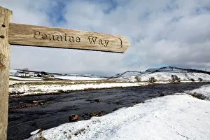 Sign for the Pennine Way walking trail on snowy landscape by the River Tees, Upper Teesdale Sign for the Pennine Way walking trail on snowy landscape by the River Tees, Upper Teesdale