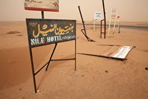 Signposts stand in the desert along the Khartoum to Atbara highway Signposts stand in the desert along the Khartoum to Atbara highway
