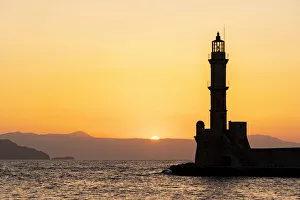 Chania Lighthouse Prints: Silhouette of the old lighthouse at sunset, Chania, Crete, Greek Islands, Greece, Europe