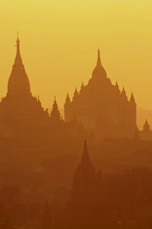 Silhouettes of the temples of the ruined city of Bagan at sunrise, Myanmar, Asia Silhouettes of the temples of the ruined city of Bagan at sunrise, Myanmar, Asia