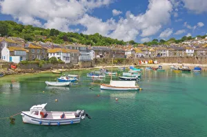 Small fishing boats in the enclosed harbour at Mousehole, Cornwall, England Small fishing boats in the enclosed harbour at Mousehole, Cornwall, England