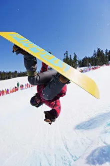A snowboarder jumping at Telus Half Pipe competition 2009 A snowboarder jumping at Telus Half Pipe competition 2009