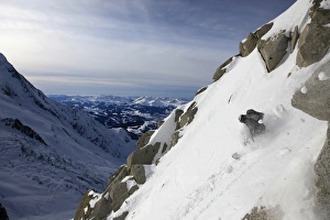 A snowboarder tackles a challenging off piste descent on Mont Blanc, Chamonix A snowboarder tackles a challenging off piste descent on Mont Blanc, Chamonix