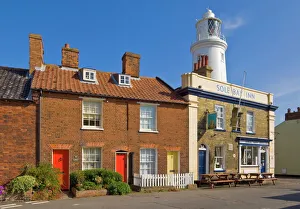 The Sole Bay Inn pub with Southwold lighthouse behind, Southwold, Suffolk The Sole Bay Inn pub with Southwold lighthouse behind, Southwold, Suffolk
