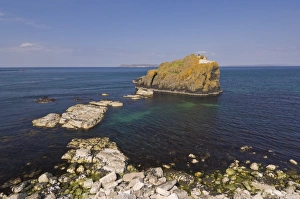 Stackaboy Island in Larrybane Bay with Rathlin Island in the background Stackaboy Island in Larrybane Bay with Rathlin Island in the background