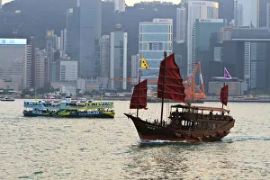 Star ferry and Chinese junk boat on Victoria Harbour, Hong Kong, China, Asia Star ferry and Chinese junk boat on Victoria Harbour, Hong Kong, China, Asia