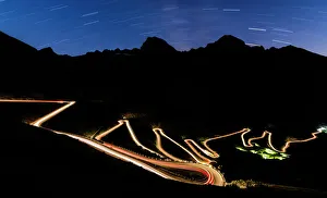 Star trail on the lights of car trace at Stelvio Pass, Valtellina, Lombardy, Trentino Alto Adige Star trail on the lights of car trace at Stelvio Pass, Valtellina, Lombardy, Trentino Alto Adige