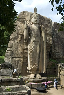 Statue of Buddha, 12 metres tall, carved in granite, Aukana, north of Dambulla Statue of Buddha, 12 metres tall, carved in granite, Aukana, north of Dambulla