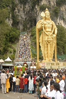 Statue of Hindu deity with pilgrims walking 272 steps Statue of Hindu deity with pilgrims walking 272 steps