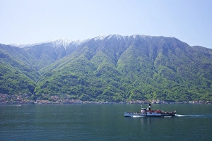 Steamer ferry boat Milano on Lake Como in spring sunshine, Italian Lakes, Northern Italy, Europe Steamer ferry boat Milano on Lake Como in spring sunshine, Italian Lakes, Northern Italy, Europe