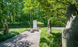 Stone statues watching over an old tomb in the gardens of Hangzhou, Zhejiang, China, Asia Stone statues watching over an old tomb in the gardens of Hangzhou, Zhejiang, China, Asia