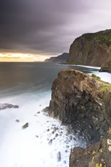 Atlantic Ocean Prints: Storm clouds over the Atlantic Ocean and cliffs at dawn, Madeira island, Portugal