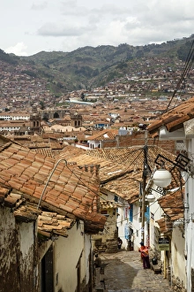 Street scene in San Blas neighbourhood with a view over the rooftops of Cuzco, UNESCO World Heritage Site, Peru Street scene in San Blas neighbourhood with a view over the rooftops of Cuzco, UNESCO World Heritage Site, Peru