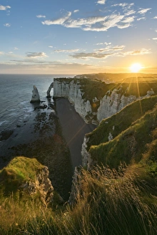 Normandy Coastal Scenery Prints: Sun rays at dawn at the cliffs, Etretat, Normandy, France, Europe