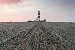Sunrise at Happisburgh Lighthouse on a frosty morning, Happisburgh, Norfolk, England Sunrise at Happisburgh Lighthouse on a frosty morning, Happisburgh, Norfolk, England
