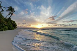 Sunrise over the Indian Ocean from a deserted beach in the Northern Huvadhu Atoll, Maldives, Indian Ocean, Asia Sunrise over the Indian Ocean from a deserted beach in the Northern Huvadhu Atoll, Maldives, Indian Ocean, Asia