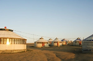 Sunrise on nomad yurt tents, Xilamuren grasslands, Inner Mongolia province, China, Asia Sunrise on nomad yurt tents, Xilamuren grasslands, Inner Mongolia province, China, Asia