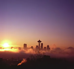 Sunrise over silhouette of Seattle skyline and Mt. Rainier, Seattle, Washington Sunrise over silhouette of Seattle skyline and Mt. Rainier, Seattle, Washington