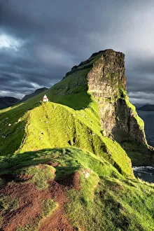 Sunset on Kallur Lighthouse on Kalsoy island, Faroe Islands, Denmark, Europe Sunset on Kallur Lighthouse on Kalsoy island, Faroe Islands, Denmark, Europe