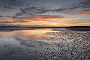 England Seaside Views Prints: Sunset reflections on sandy beach at sunset