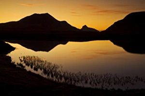 Sunset silhouette at Lochan an Ais, Inverpolly, Sutherland, north west Scotland Sunset silhouette at Lochan an Ais, Inverpolly, Sutherland, north west Scotland