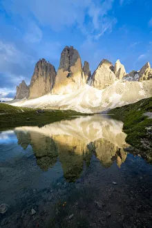 Sunset over Tre Cime di Lavaredo mirrored in Grava Longa lakes Sunset over Tre Cime di Lavaredo mirrored in Grava Longa lakes