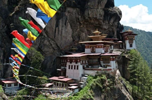 Images Dated 26th May 2011: Taktshang Goemba (Tigers nest monastery) with prayer flags and cliff, Paro Valley, Bhutan, Asia
