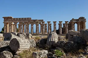 Temple of Athena ruins and Temple of Hera in the background at Selinunte, the ancient Greek city on the southern coast of Sicily, Italy, Europe Temple of Athena ruins and Temple of Hera in the background at Selinunte, the ancient Greek city on the southern coast of Sicily, Italy, Europe