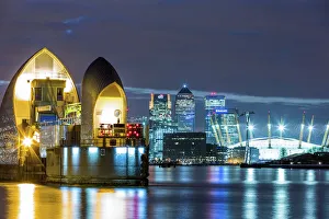 Thames Barrier, Millennium Dome (O2 Arena) and Canary Wharf at night, London, England Thames Barrier, Millennium Dome (O2 Arena) and Canary Wharf at night, London, England
