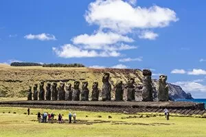 Ahu Tongariki Collection: Tourists at the 15 moai restored ceremonial site of Ahu Tongariki on Easter Island (Isla de Pascua)