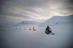 Tourists on snowmobiles (skidoos) near Barentsburg, Svalbard, Arctic, Norway, Scandinavia, Europe Tourists on snowmobiles (skidoos) near Barentsburg, Svalbard, Arctic, Norway, Scandinavia, Europe