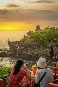 Images Dated 28th March 2023: Tourists at Tanah Lot, traditional Balinese temple at sunset, Beraban, Kediri, Tabanan Regency
