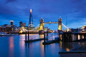 Images Dated 11th November 2021: Tower Bridge and The Shard at sunset with a low tide on the River Thames, London, England