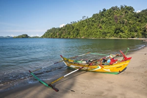 Traditional Indonesian fishing boat on the beach at Sungai Pinang Fishing Village Traditional Indonesian fishing boat on the beach at Sungai Pinang Fishing Village