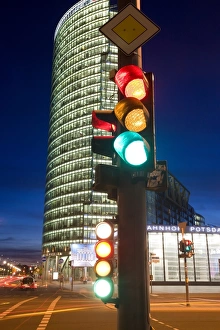 Traffic signal and office buildings illuminated at Traffic signal and office buildings illuminated at