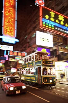 Tram and taxi with neon lights, Hong Kong, China, Asia Tram and taxi with neon lights, Hong Kong, China, Asia