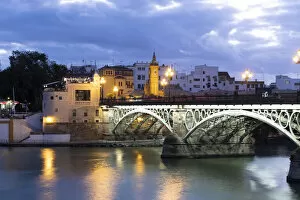 Andaluc And Xc3 Collection: The Triana Bridge (Puente de Triana) (Puente de Isabelle II) at twilight, Seville