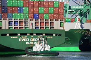Tugboat and container ship, San Pedro Port, Los Angeles, California, United States of America Tugboat and container ship, San Pedro Port, Los Angeles, California, United States of America