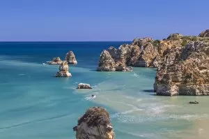 Images Dated 3rd July 2015: The turquoise water of the Atlantic Ocean and cliffs surrounding Praia Dona Ana beach