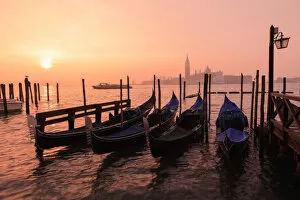 Images Dated 19th February 2020: Venetian sunrise, winter fog, gondolas, San Giorgio Maggiore and Lido, Venice