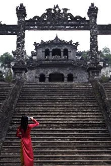Vietnamese schoolgirl taking picture of Khai Dinhs Tomb, Hue, Vietnam Vietnamese schoolgirl taking picture of Khai Dinhs Tomb, Hue, Vietnam