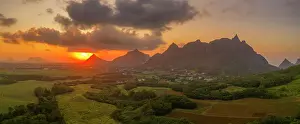Mauritius Landscape Prints: View of golden sunset behind Long Mountain and patchwork of green fields