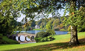 View across lake to the distant Pantheon in autumn, with Palladian bridge View across lake to the distant Pantheon in autumn, with Palladian bridge