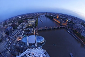View of passenger pod capsule, Houses of Parliament, Big Ben and the River Thames from the London Eye at dusk, London View of passenger pod capsule, Houses of Parliament, Big Ben and the River Thames from the London Eye at dusk, London