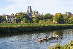 View across the River Wear to Durham Cathedral, female college rowers in training, Durham, County Durham, England View across the River Wear to Durham Cathedral, female college rowers in training, Durham, County Durham, England
